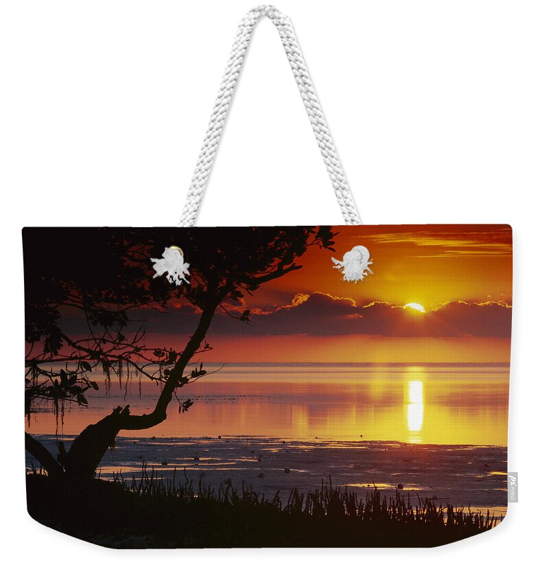 00175659 Weekender Tote Bag featuring the photograph Sunset Over Annes Beach Florida by Tim Fitzharris