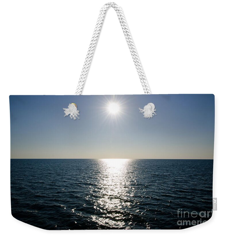 Sun Weekender Tote Bag featuring the photograph Sunshine over the mediterranean sea by Mats Silvan