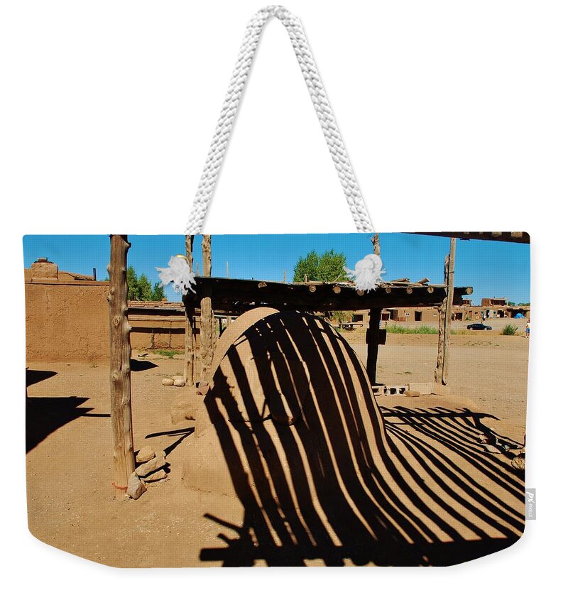 Taos Pueblo Weekender Tote Bag featuring the photograph Taos Pueblo reflections by Dany Lison