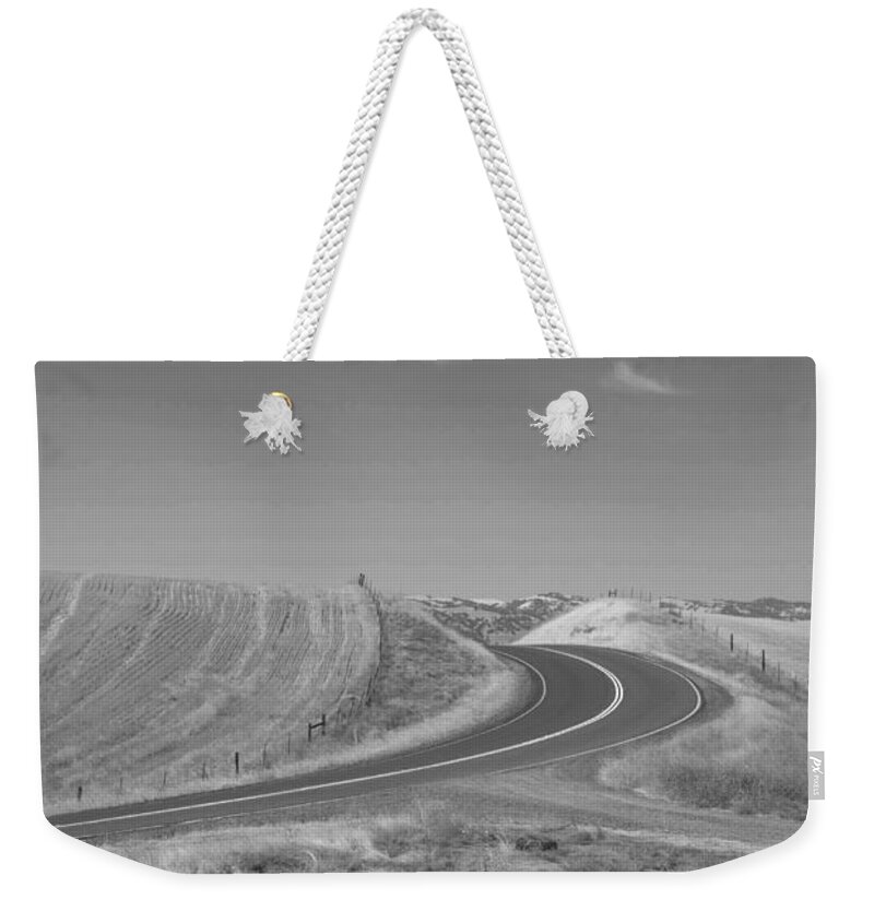 Landscape Weekender Tote Bag featuring the photograph The Quiet Road by Kathleen Grace