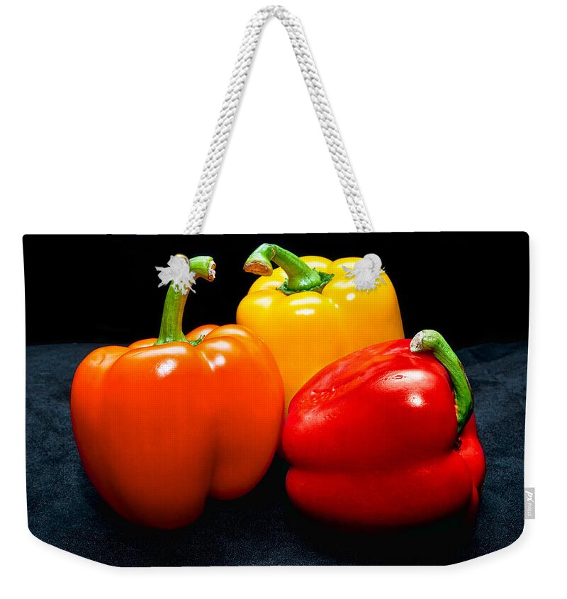 Vegetable Weekender Tote Bag featuring the photograph The Three Peppers by Christopher Holmes