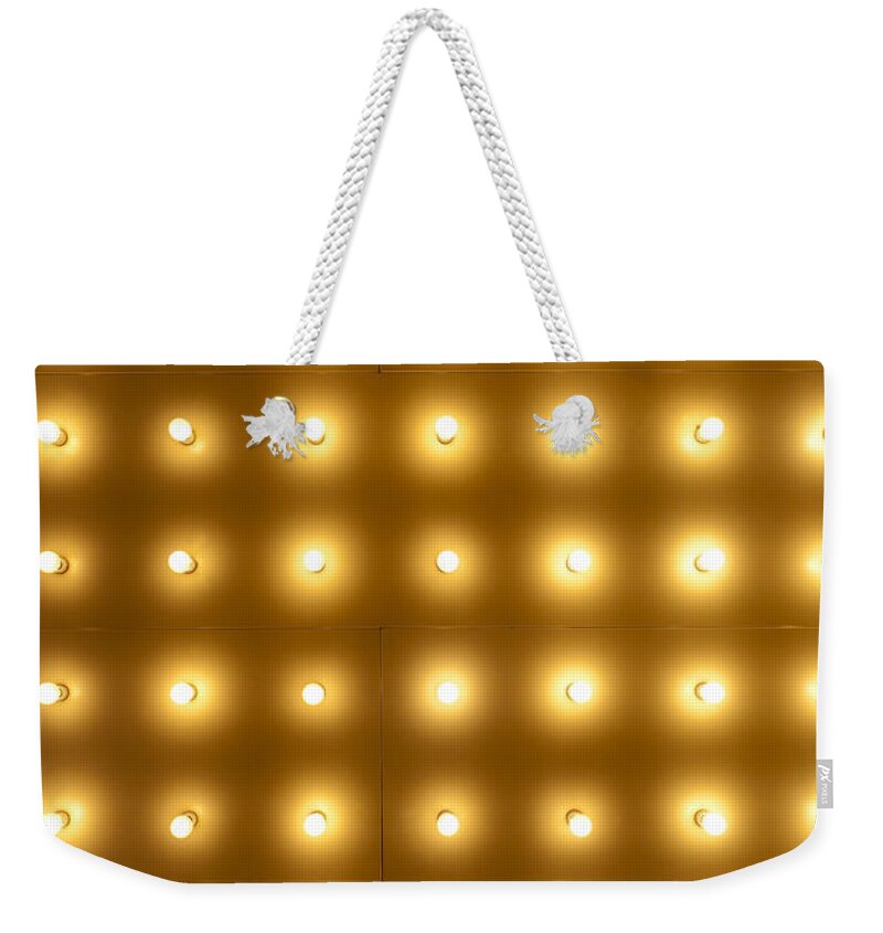 Abstract Weekender Tote Bag featuring the photograph Theater Lights in Rows by Paul Velgos