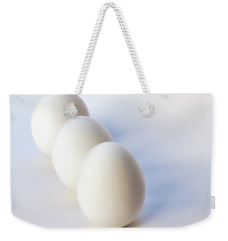 Endre Weekender Tote Bag featuring the photograph Three Eggs In a Row by Endre Balogh
