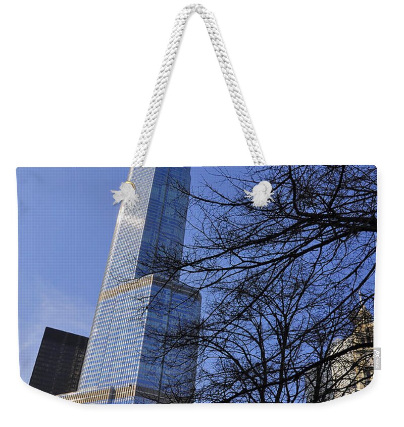Trump Tower Weekender Tote Bag featuring the photograph Trough the branches by Dejan Jovanovic