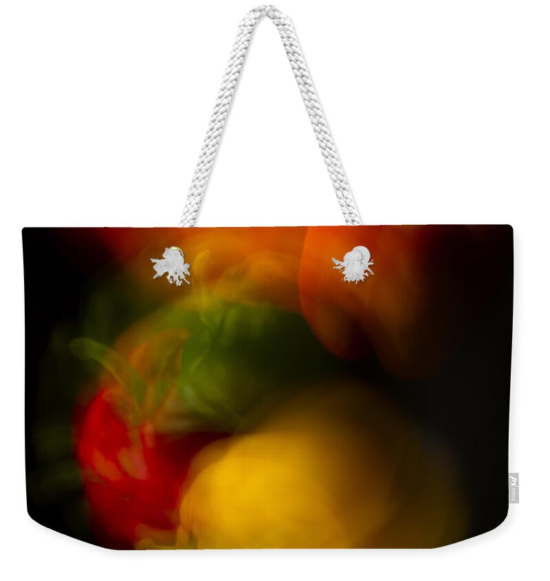 Colorful Weekender Tote Bag featuring the photograph Twisting Peppers by Frederic A Reinecke