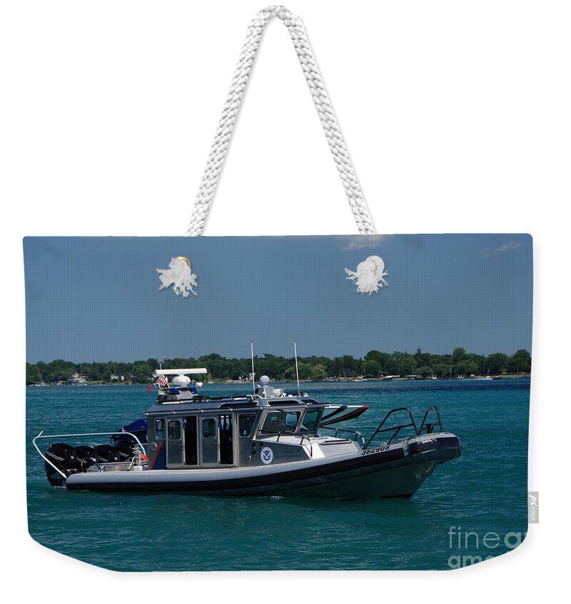 U.s. Customs Weekender Tote Bag featuring the photograph U.S. Customs Border Protection by Grace Grogan