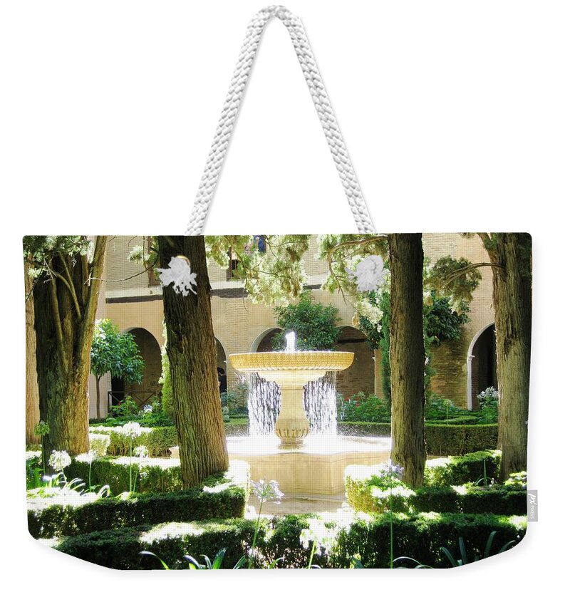 Water Weekender Tote Bag featuring the photograph Water Fountain With Sunlight Shinning Thru It Granada Spain by John Shiron
