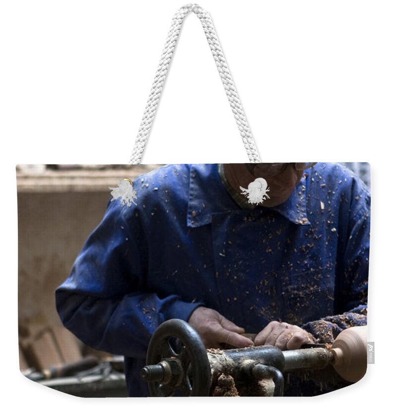 Toledo Weekender Tote Bag featuring the photograph Working His Trade by Lorraine Devon Wilke