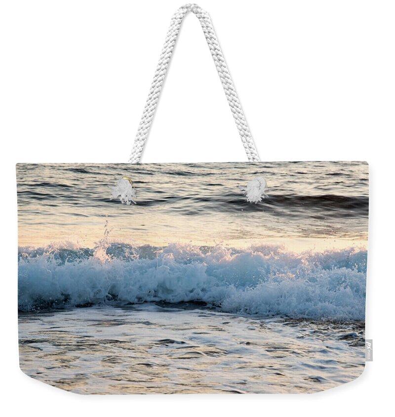 Coast Weekender Tote Bag featuring the photograph Sea waves late in the evening by Michalakis Ppalis