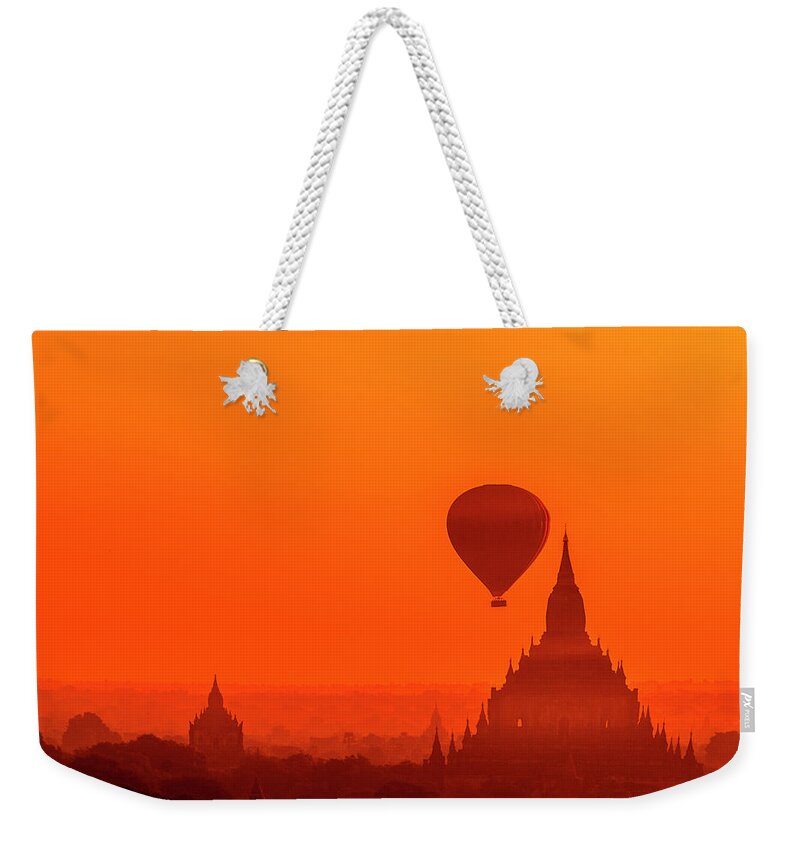 Travel Weekender Tote Bag featuring the photograph Bagan pagodas and hot air balloon #1 by Pradeep Raja Prints