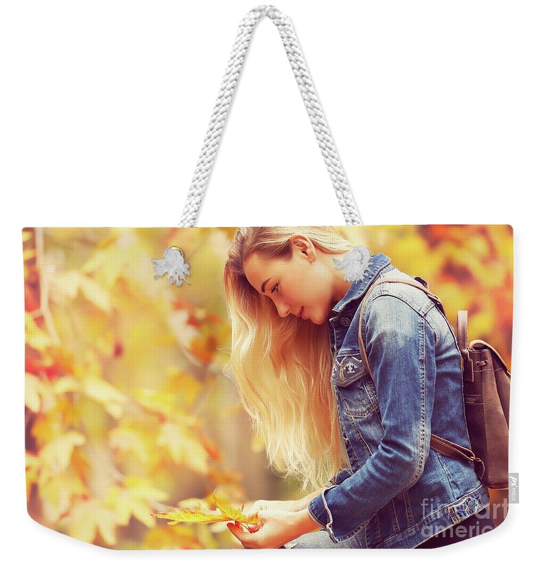 Autumn Weekender Tote Bag featuring the photograph Beautiful model in autumn park #1 by Anna Om