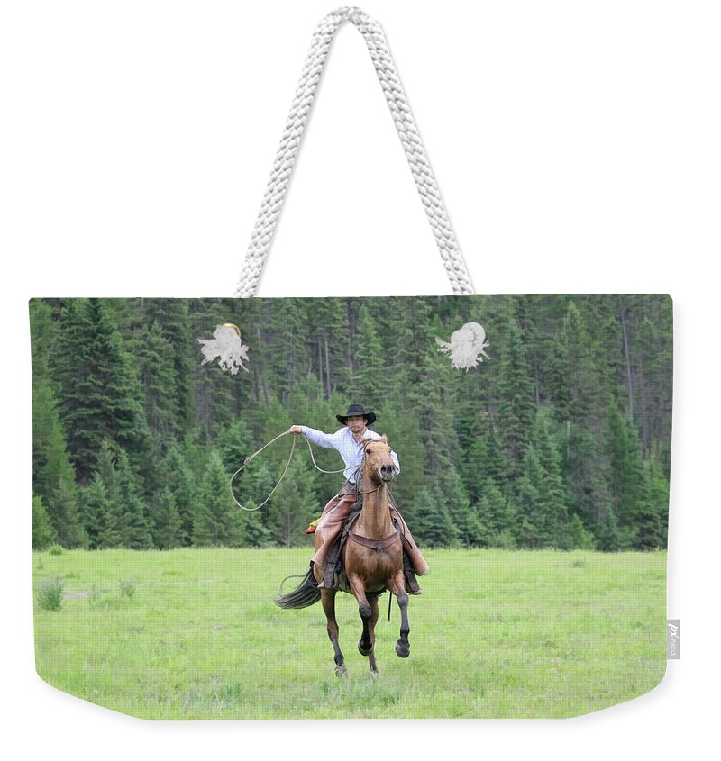 Cowboy Weekender Tote Bag featuring the photograph Cowboy #1 by Steve McKinzie