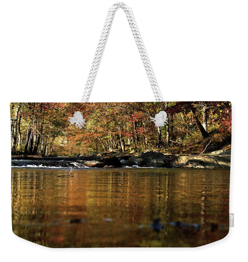 Water Weekender Tote Bag featuring the photograph Creek water flowing through woods in autumn #1 by Emanuel Tanjala