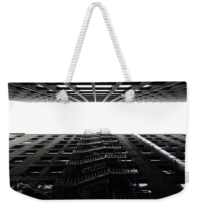 Urban Weekender Tote Bag featuring the photograph Escape by Kreddible Trout