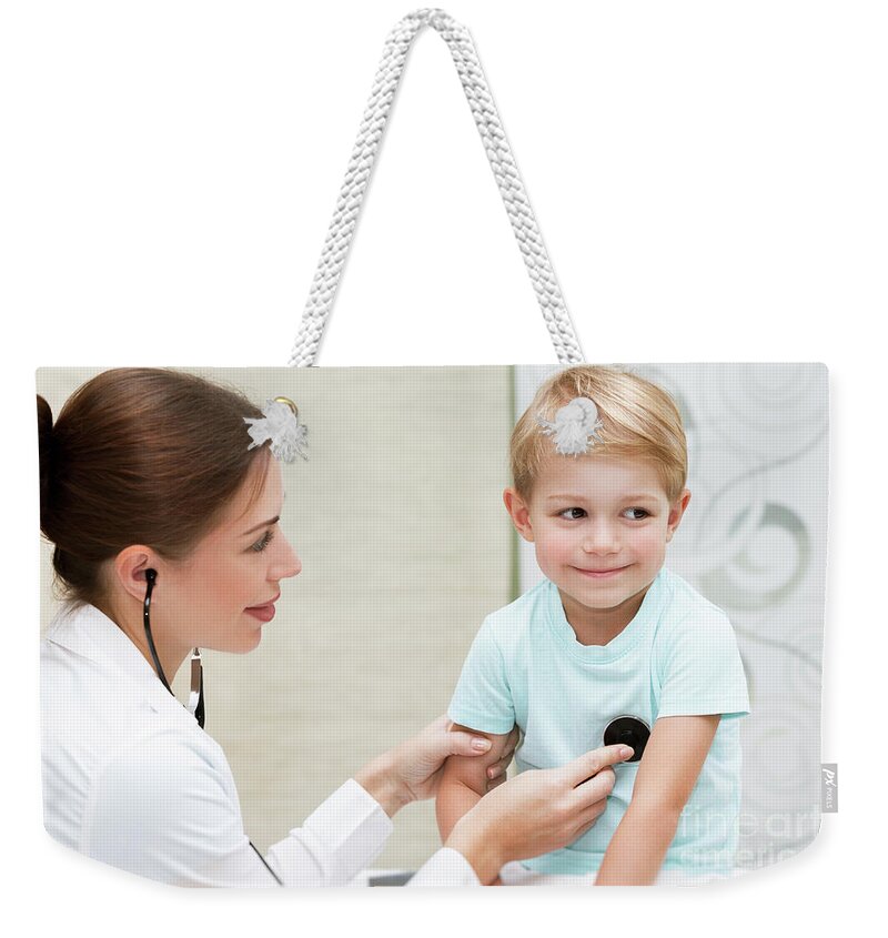 At Work Weekender Tote Bag featuring the photograph Happy boy at the doctor #1 by Anna Om