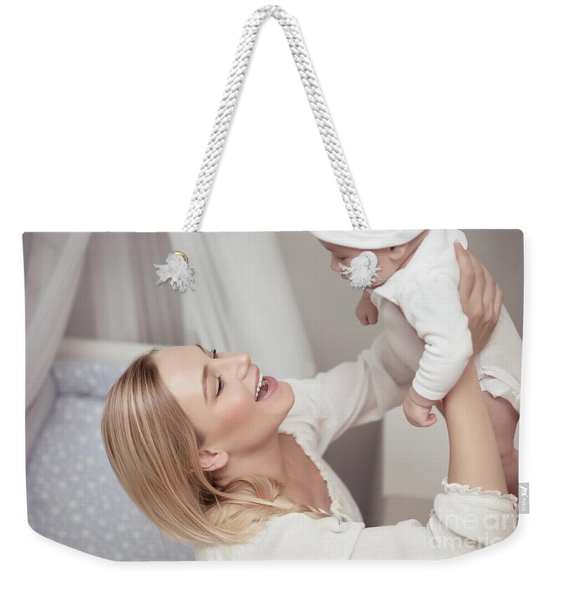 Baby Weekender Tote Bag featuring the photograph Happy mother with her baby #1 by Anna Om