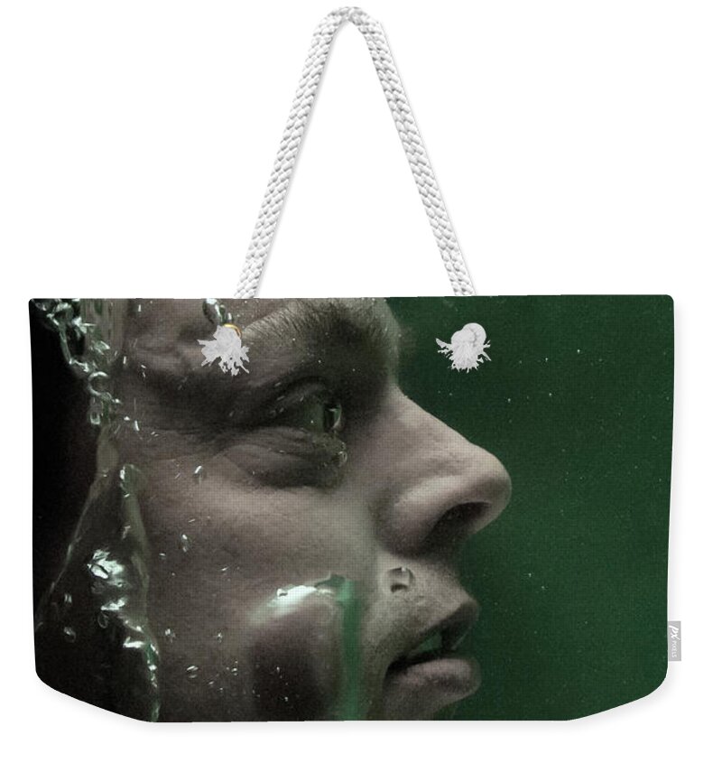 Man Weekender Tote Bag featuring the photograph Man underwater two by Clayton Bastiani