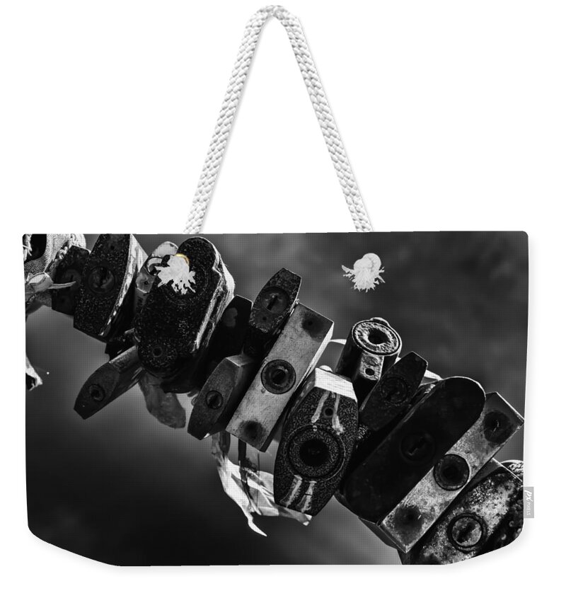 Abstract Weekender Tote Bag featuring the photograph Sealed Metal Padlocks of Endless Time by John Williams