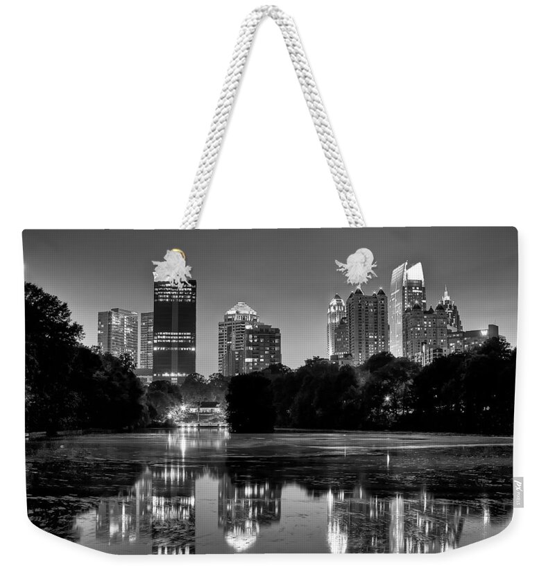 Night Weekender Tote Bag featuring the photograph Night Atlanta.Piedmont Park lake. by Anna Rumiantseva
