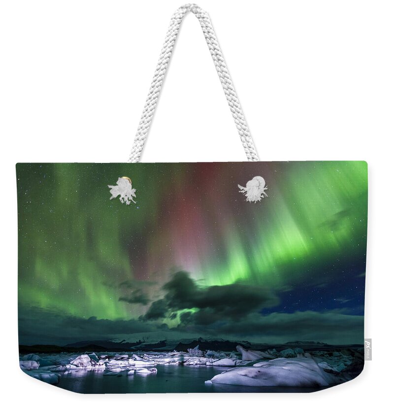 Europe Weekender Tote Bag featuring the photograph Iceland night show by Alexey Stiop