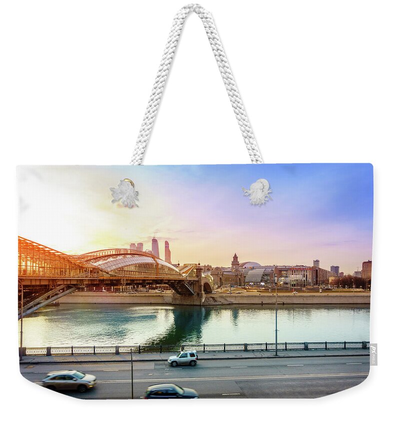 Kiev Weekender Tote Bag featuring the photograph Pedestrian bridge across the Moscow River #1 by Alexey Stiop