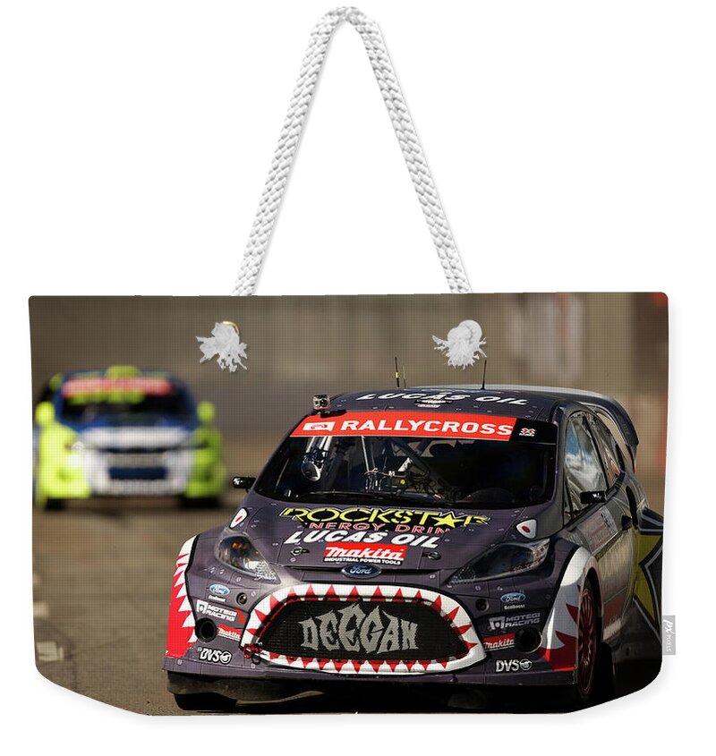 Racing Weekender Tote Bag featuring the photograph Racing #1 by Jackie Russo