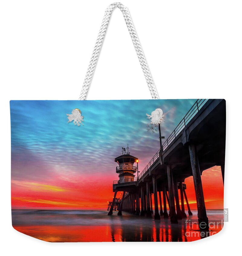 Ruby’s Weekender Tote Bag featuring the photograph Sunset at Huntington Beach Pier #1 by Peter Dang