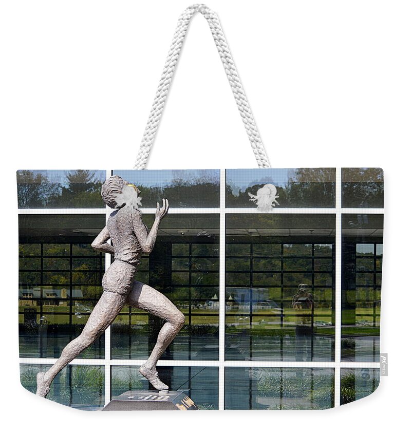 Statue Weekender Tote Bag featuring the photograph The Runner #1 by AJ Schibig
