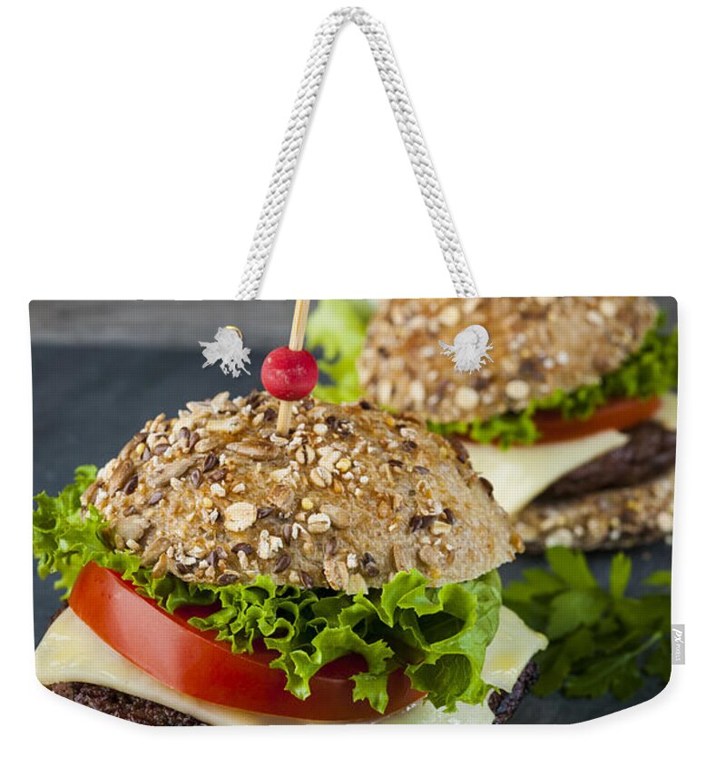 Hamburgers Weekender Tote Bag featuring the photograph Two gourmet hamburgers 2 by Elena Elisseeva