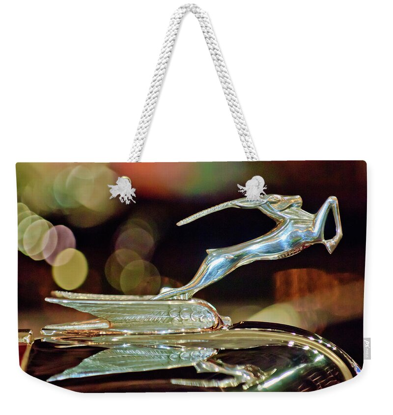 1932 Chrysler Imperial Convertible Sedan Weekender Tote Bag featuring the photograph 1932 Chrysler Imperial Hood Ornament 1 by Jill Reger