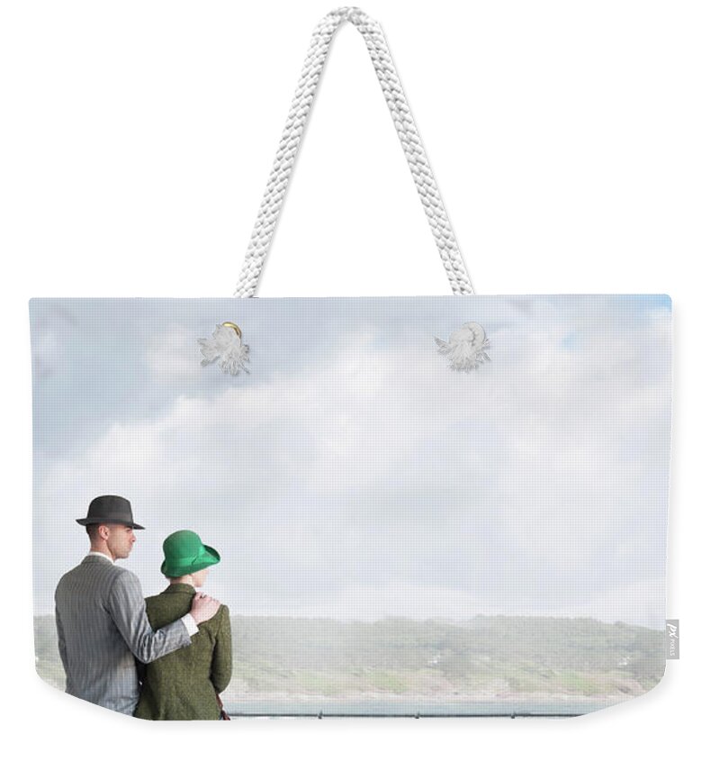 1940s Weekender Tote Bag featuring the photograph 1940s Couple On The Seafront by Lee Avison