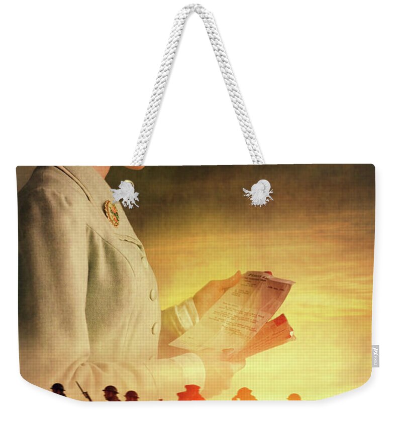 1940s Weekender Tote Bag featuring the photograph 1940s Woman Reading A War Letter With Soldiers Marching by Lee Avison