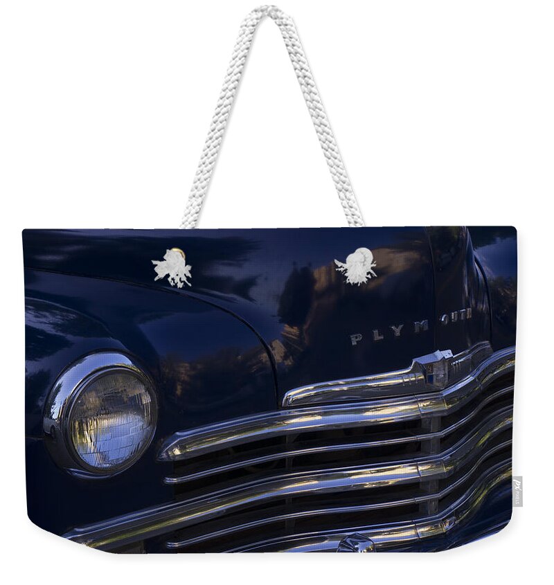 1949 Plymouth Weekender Tote Bag featuring the photograph 1949 Plymouth Deluxe by Cathy Anderson