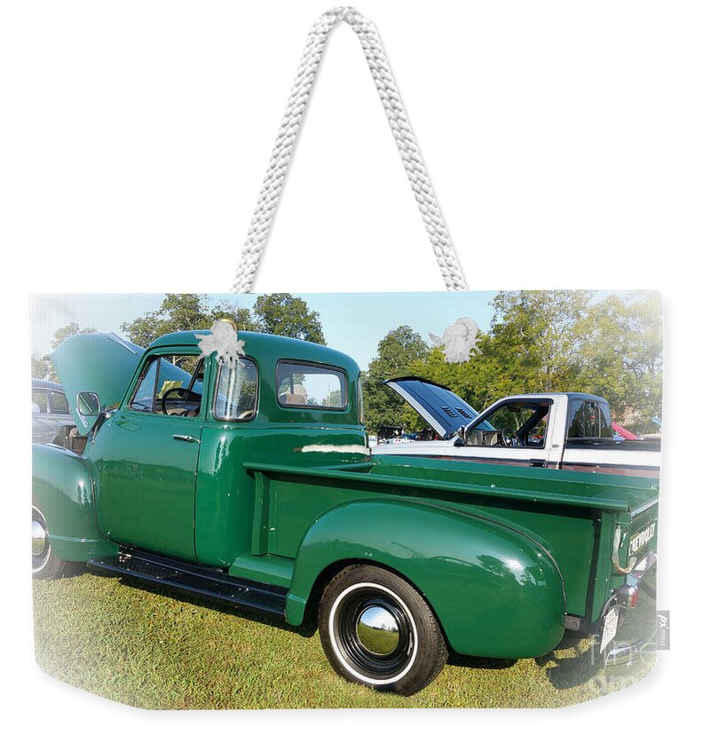 1952 Chevrolet Weekender Tote Bag featuring the photograph 1952 Chevrolet by Geraldine DeBoer