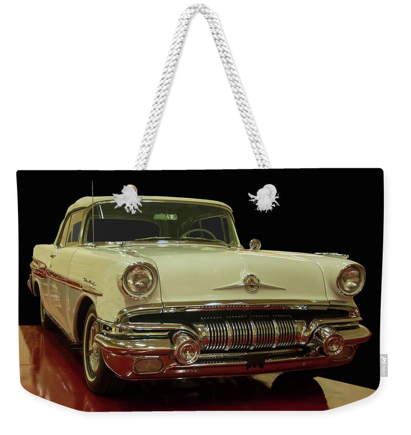 1957 Pontiac Star Chief Convertible Weekender Tote Bag featuring the photograph 1957 Pontiac Star Chief Convertible by Flees Photos