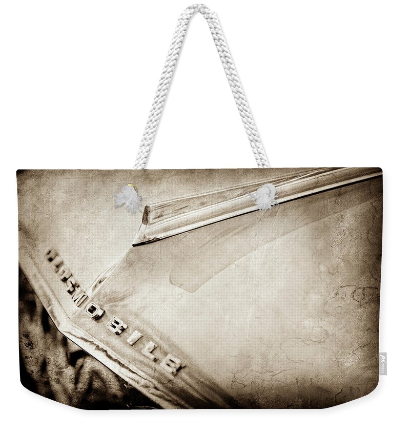 1962 Oldsmobile Hood Ornament And Emblem Weekender Tote Bag featuring the photograph 1962 Oldsmobile Hood Ornament and Emblem -0598s by Jill Reger