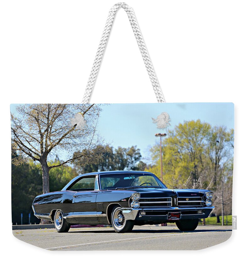 Pontiac Weekender Tote Bag featuring the photograph 1965 Pontiac 2 plus 2 by Steve Natale