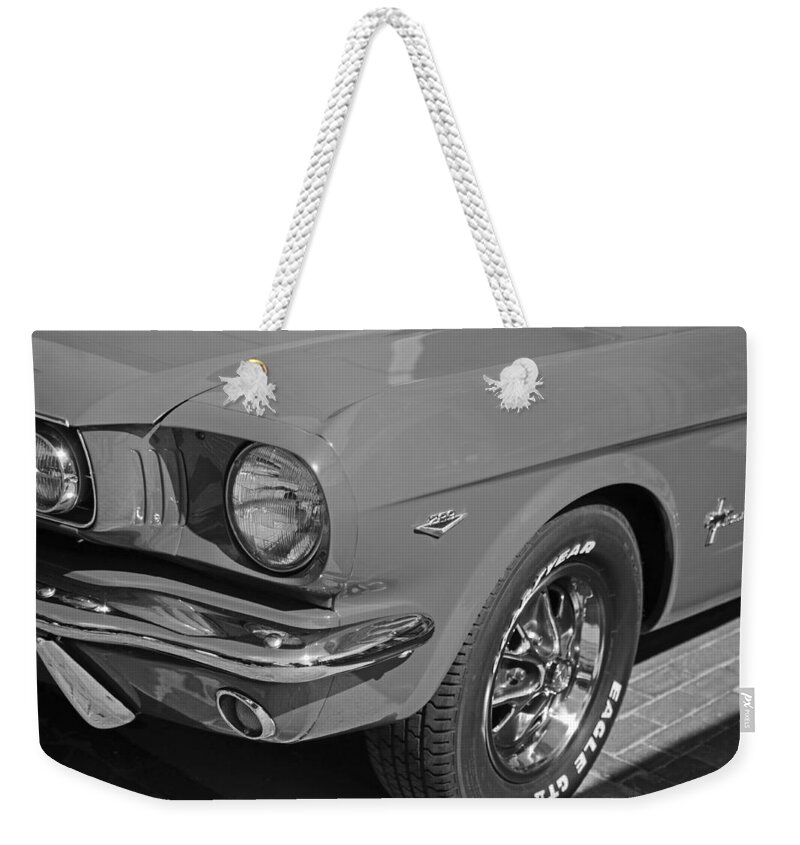 1965 Weekender Tote Bag featuring the photograph 1965 Red Ford Mustang Classic Car Black and White by Toby McGuire