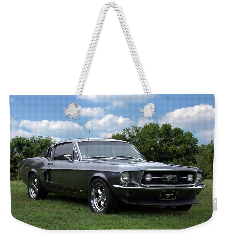 1967 Mustang Weekender Tote Bag featuring the photograph 1967 Mustang Fast Back by Tim McCullough