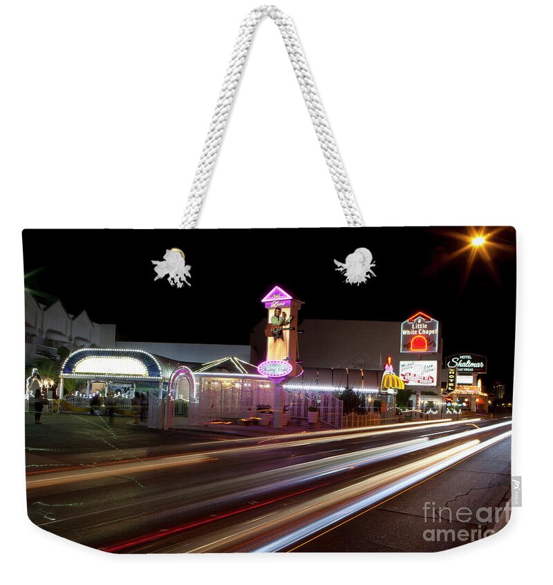 Vegas Weekender Tote Bag featuring the photograph Little White Chapel wedding chapel on Las Vegas #2 by Anthony Totah