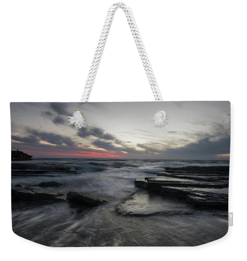 Seascape Weekender Tote Bag featuring the photograph Shipwreck of an abandoned ship on a rocky shore by Michalakis Ppalis