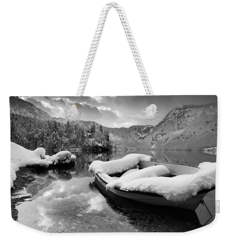Bohinj Weekender Tote Bag featuring the photograph Snow covered boat on Lake Bohinj in Winter #2 by Ian Middleton