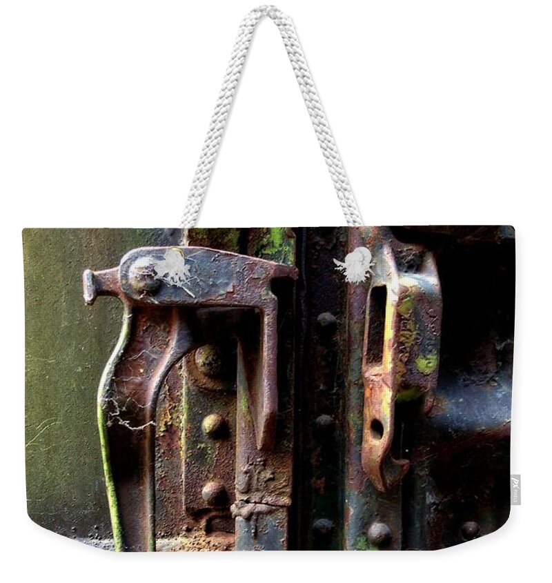 Newel Hunter Weekender Tote Bag featuring the photograph Unhinged #2 by Newel Hunter