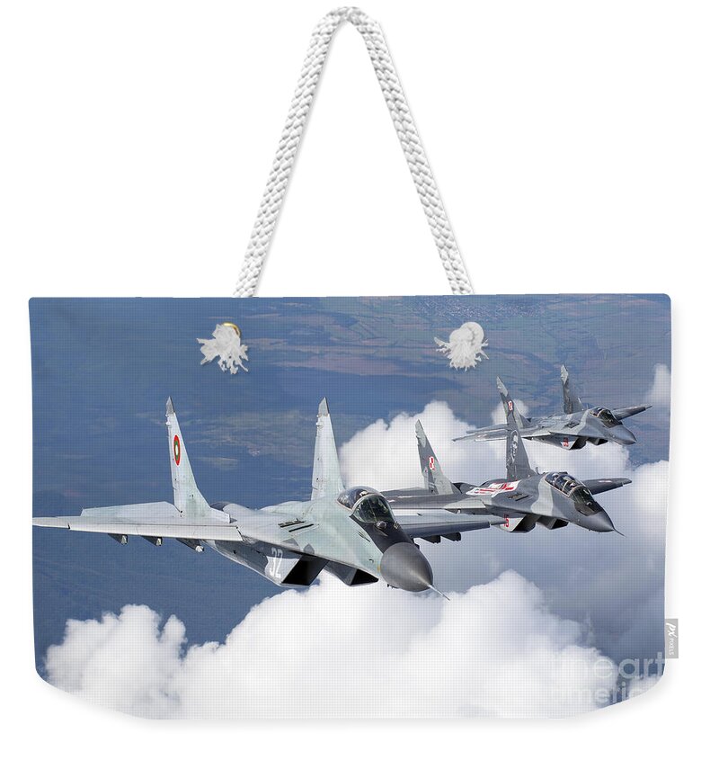 Horizontal Weekender Tote Bag featuring the photograph Bulgarian And Polish Air Force Mig-29s #3 by Daniele Faccioli