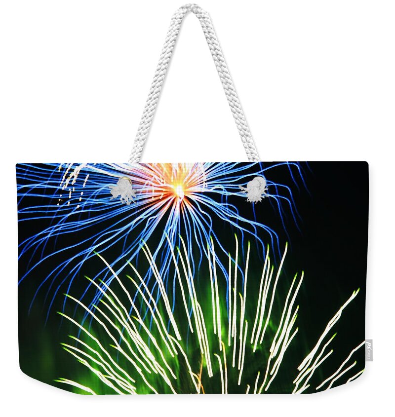 Firework Weekender Tote Bag featuring the photograph Fireworks by Donn Ingemie