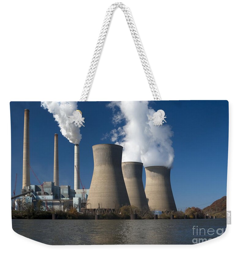 Tower Weekender Tote Bag featuring the photograph Three cooling towers at a power plant. #4 by Anthony Totah