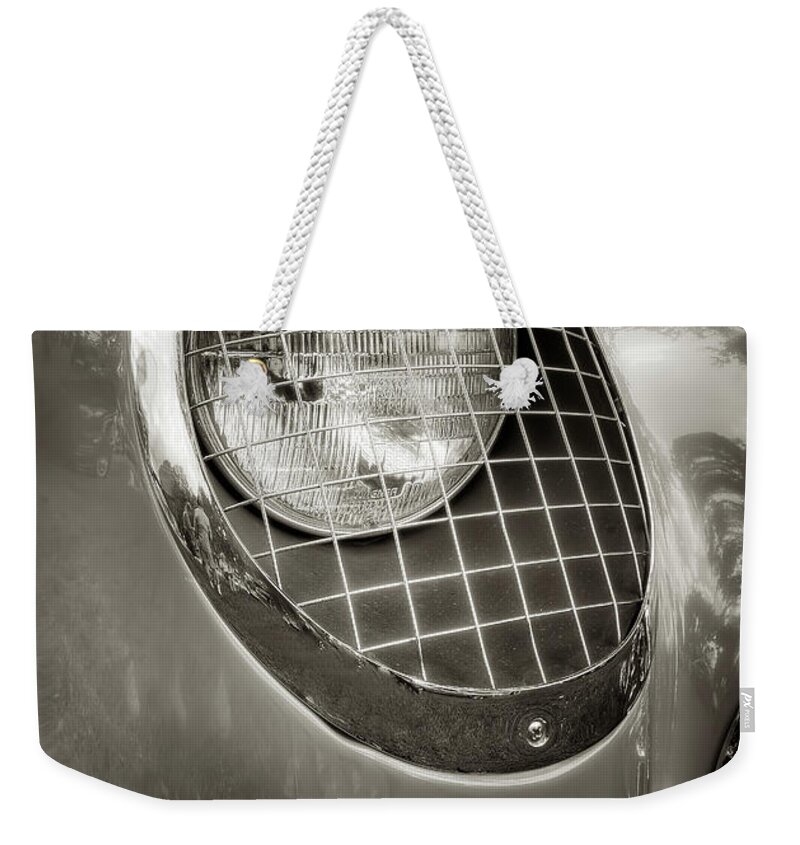 1955 Corvette Weekender Tote Bag featuring the photograph 55 Vette Headlight by Arttography LLC