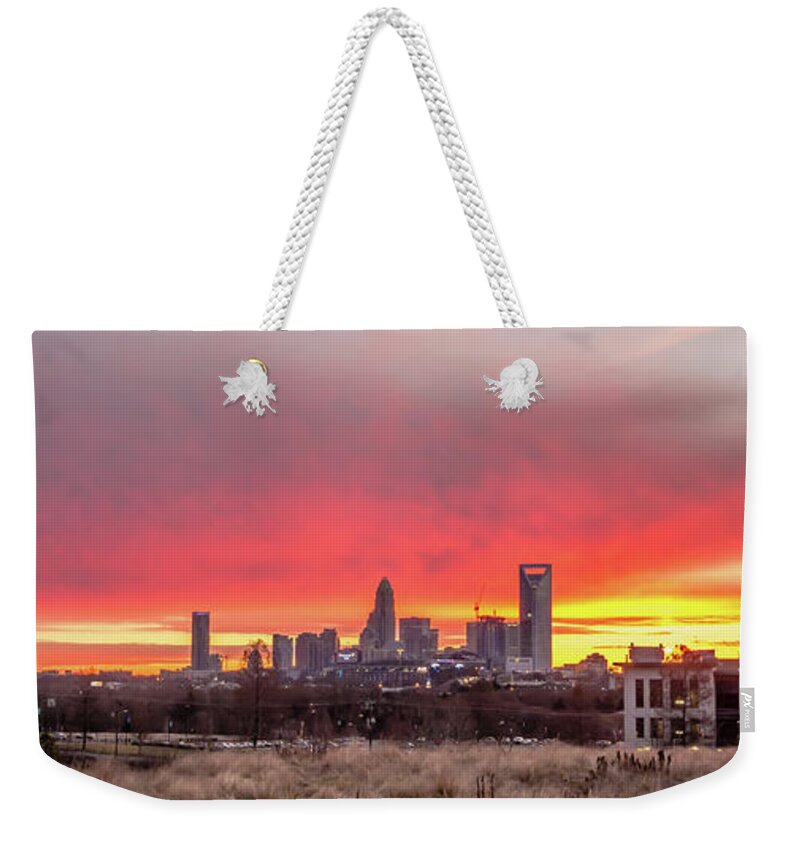 Red Weekender Tote Bag featuring the photograph Charlotte The Queen City Skyline At Sunrise #7 by Alex Grichenko