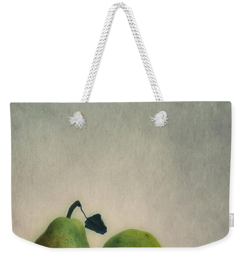 Pear Weekender Tote Bag featuring the photograph A couple of pears by Priska Wettstein
