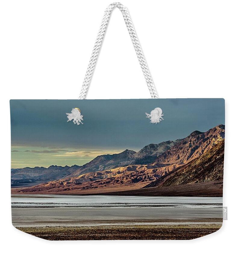 Last Light Weekender Tote Bag featuring the photograph A glow on the Amargosa Range by Gaelyn Olmsted
